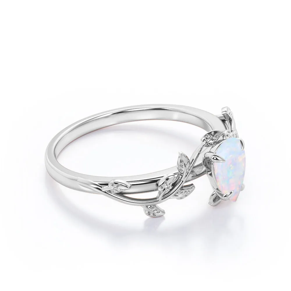 1 carat Pear cut Ethiopian Opal Vintage Engagement ring in Yellow gold