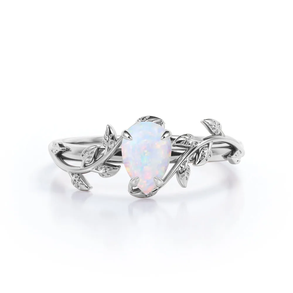 1 carat Pear cut Ethiopian Opal Vintage Engagement ring in Yellow gold