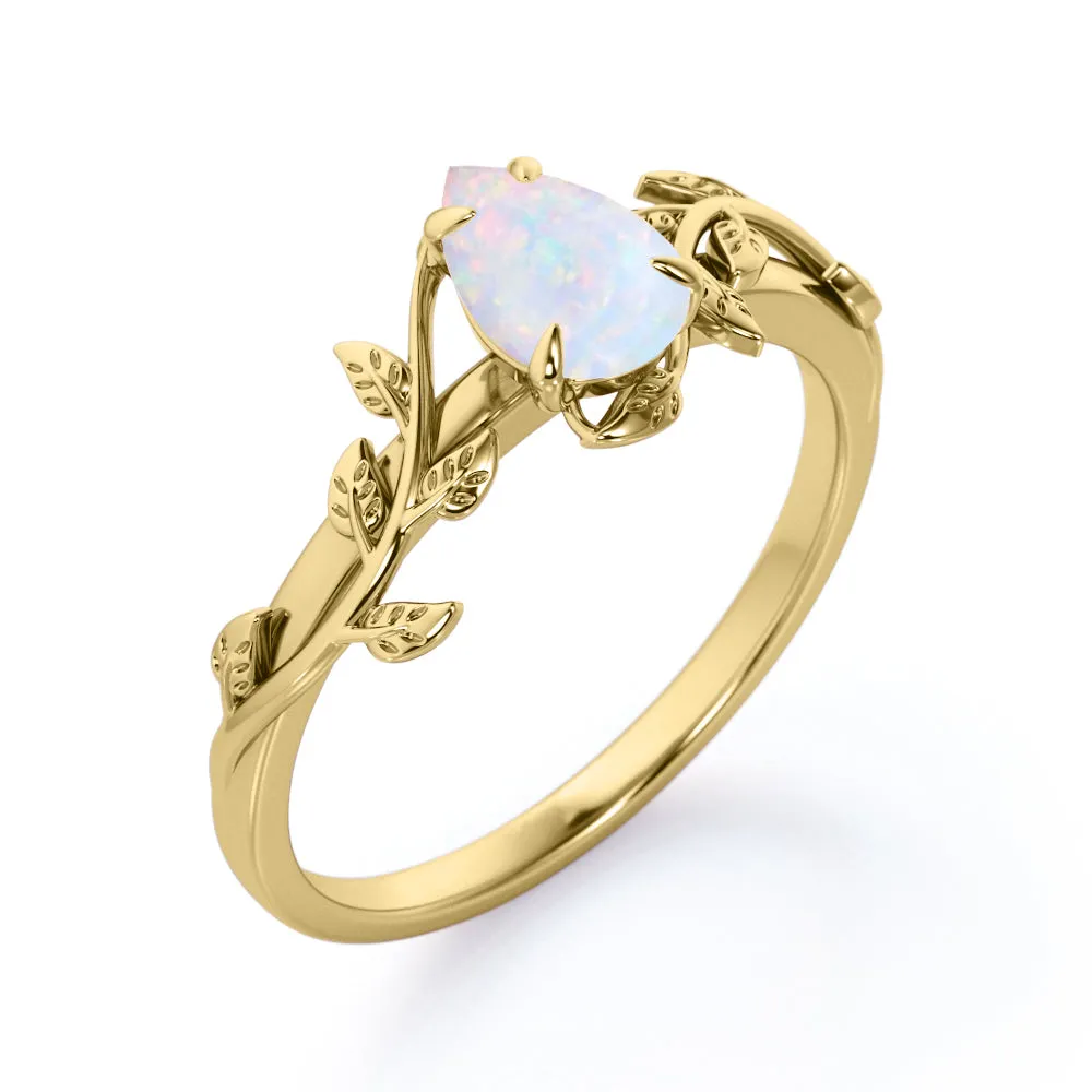 1 carat Pear cut Ethiopian Opal Vintage Engagement ring in Yellow gold