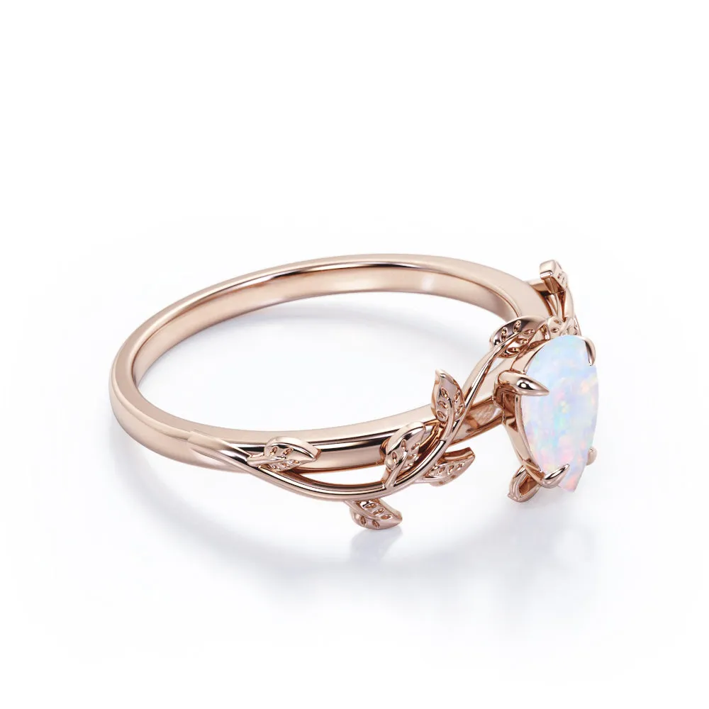 1 carat Pear cut Ethiopian Opal Vintage Engagement ring in Yellow gold