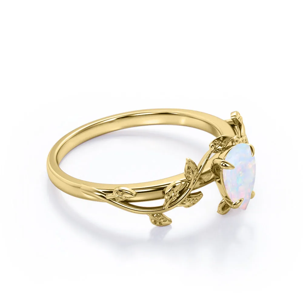 1 carat Pear cut Ethiopian Opal Vintage Engagement ring in Yellow gold