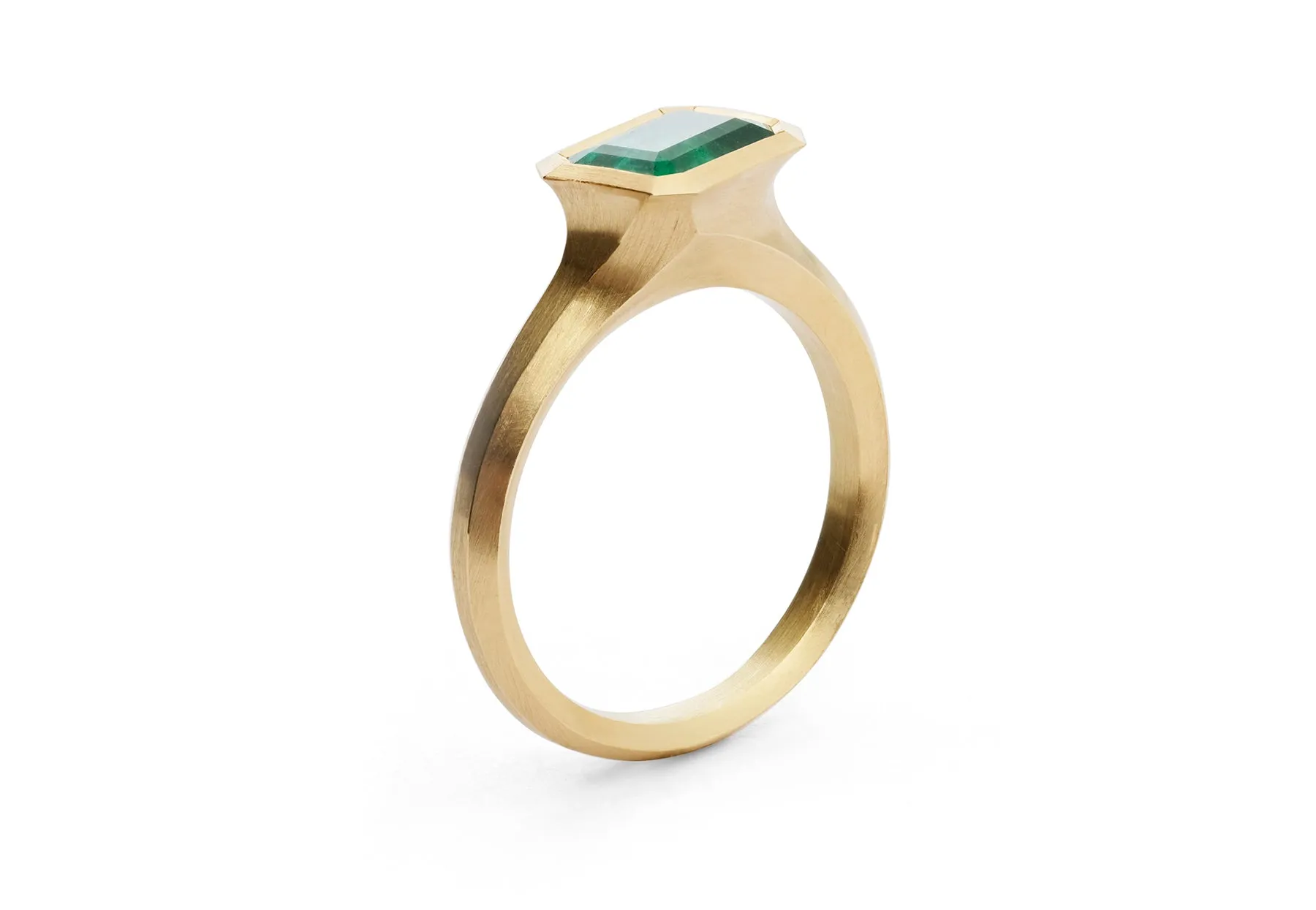 Arris carved yellow gold and Zambian emerald ring