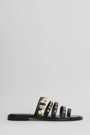 Flats in black leather