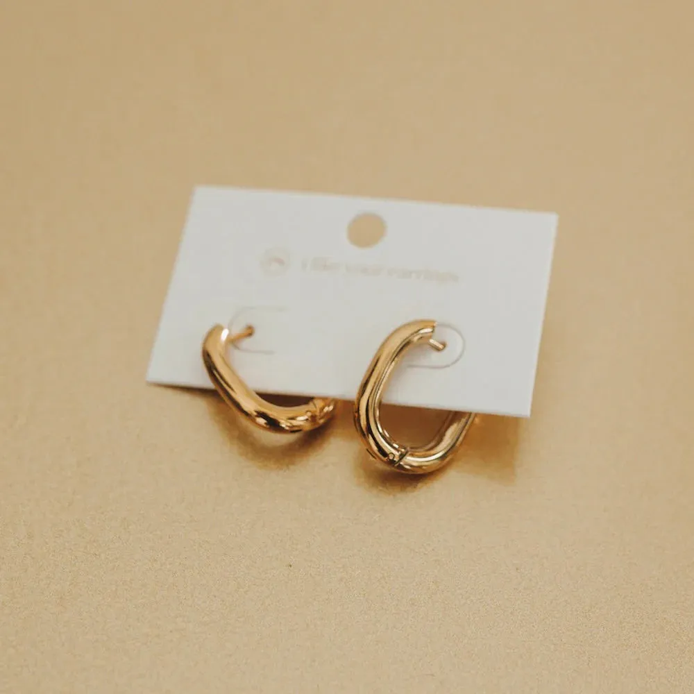 Flirty Fantasy Oval Hoop Earrings by Pretty Simple