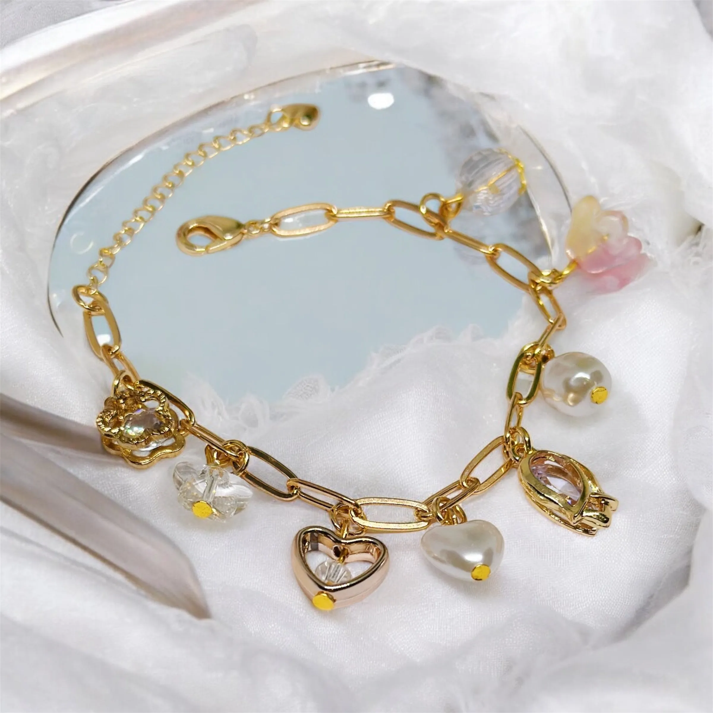 Golden chain bracelets with pearls and flower beads