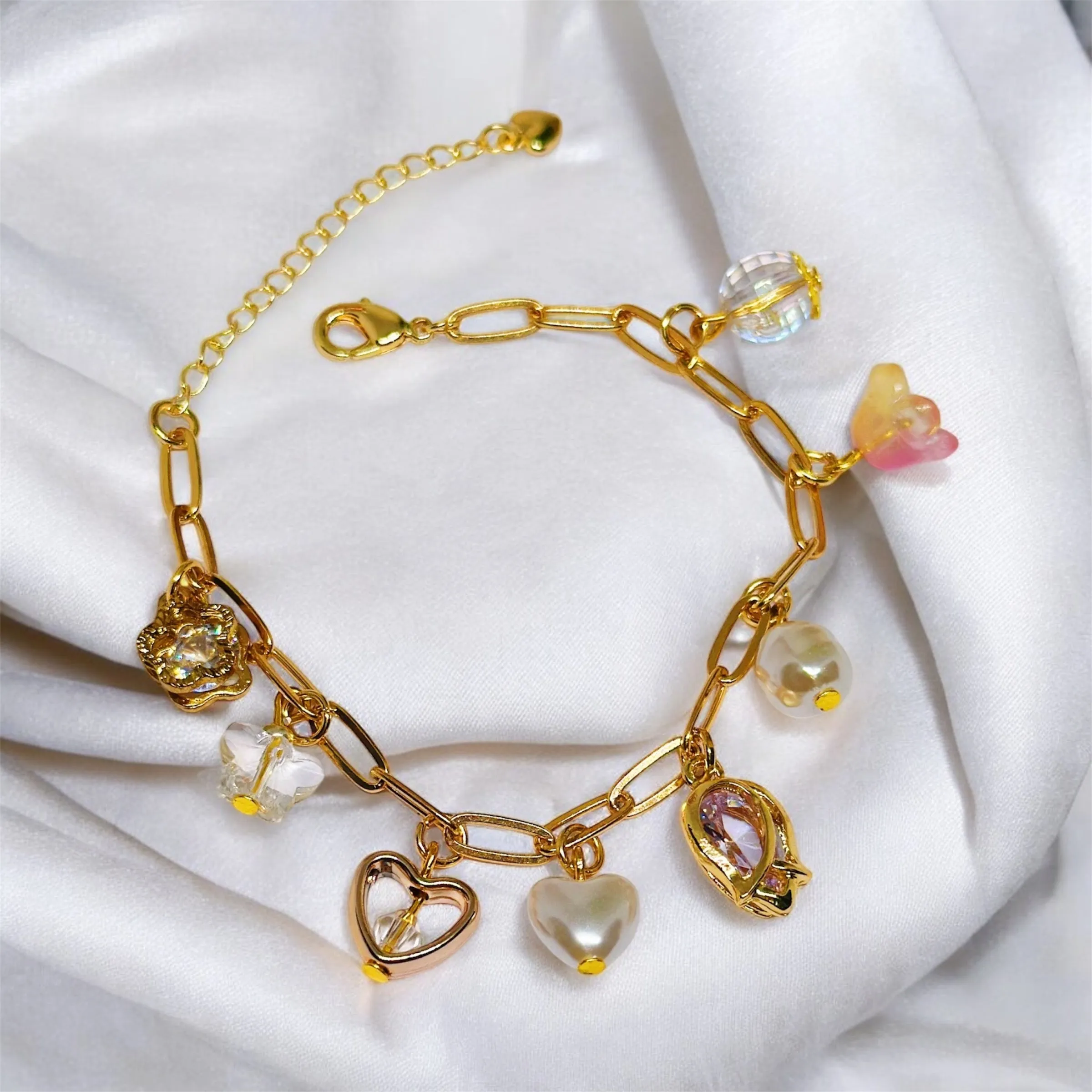 Golden chain bracelets with pearls and flower beads