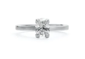 Platinum four claw talon engagement ring with oval white diamond